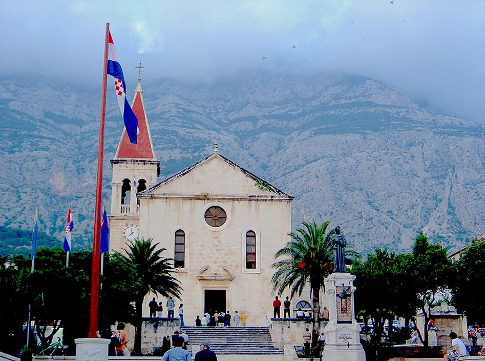 Makarska, a small town on the mainland with dramatic cliffs of the in the back drop.